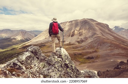 Hiking Man In Canadian Mountains. Hike Is The Popular Recreation Activity In North America. There Are A Lot Of Picturesque Trails.