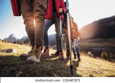 Hiking Man And Woman With Trekking Boots On The Trail