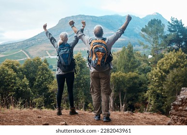 Hiking, mature couple and arms raised on cliff from back on nature walk and mountain in view in Peru. Travel, senior man and woman celebrate forest hike with love and achievement on holiday adventure - Powered by Shutterstock