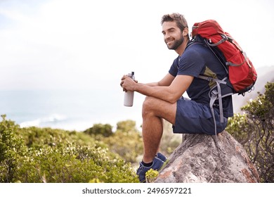 Hiking, mountain and man rest on a rock thinking after exercise, workout and fitness in nature for wellness. Travel, vacation and male person or athlete smile at a view after training and trekking - Powered by Shutterstock