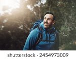 Hiking, nature and man in nature thinking with backpack for adventure, trekking and freedom. Travel, fitness and person outdoors for wellness, fresh air and exercise on holiday, journey or vacation