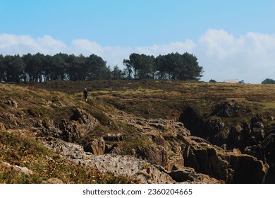 Hiking on the cliffs on a coastal path in Brittany, France - Powered by Shutterstock