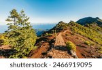 Hiking on the highest peak of Madeira Pico Ruivo next to the cottage Abrigo do Pico Ruivo. Views of the surrounding mountains lanscape during sunny day