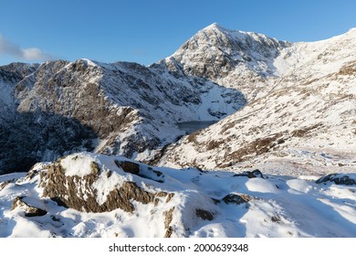 Hiking On Pyg Track Climbing Mount Snowdon, Snowcaped Snowdonia, North Wales In The Sun And Snow