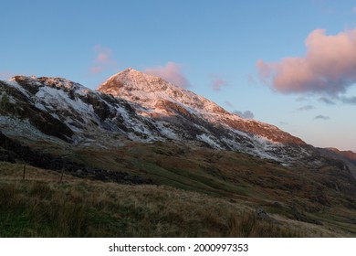 Hiking On Pyg Track Climbing Mount Snowdon, Snowcaped Snowdonia, North Wales In The Sun And Snow