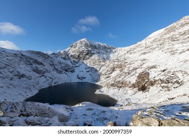 Hiking On Pyg Track Climbing Mount Snowdon, Snowcaped Snowdonia, North Wales In The Sun And Snow