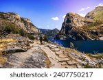 Hiking on the shoreline of Hetch Hetchy reservoir in Yosemite National Park, Sierra Nevada mountains, California; the reservoir is one of the main sources of drinking water for the San Francisco bay