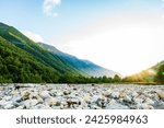 Hiking outdoor landscape with sky covered in strong sunlight for copyspace. mountains and river on the adventure hiking route near Mestia village in Svaneti region, Georgia.