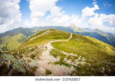 Hiking Path In The Mountains Wide Angle View Blue Sky Green Meadow No People