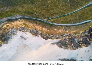 Hiking Path Through Green Heath On Rocky Sandy Beach. Aerial View.