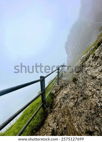 Similar – Image, Stock Photo Mountain top covered with fog in the Alps