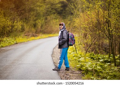 Hiking. Senior 60 Years Old Woman Hiker Smiling Walk In Autumn Forest. Active Retirement Concept