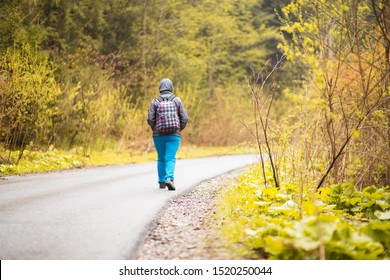 Hiking. Senior 60 Years Old Woman Hiker Smiling Walk In Autumn Forest. Active Retirement Concept