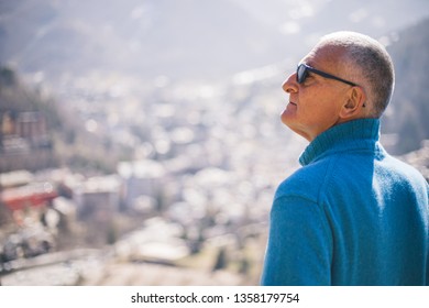 Hiking Senior Man In Mountian Looking The Nature View With A Panorama Of The City - Limone Piemonte, Italy 