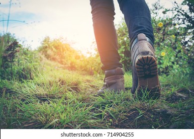 hiking shoes in action on a mountain desert trail path. Close-up of female hikers shoes.
 - Shutterstock ID 714904255