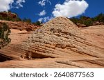 hiking the slick rock out to the man-made kanab sand caves along utah state highway 89. north of kanab, utah, on a sunny summer day