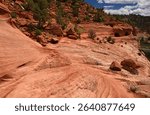 hiking the slick rock out to the man-made kanab sand caves along utah state highway 89. north of kanab, utah, on a sunny summer day