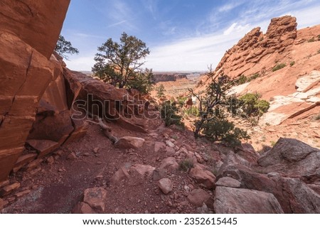 hiking the syncline loop trail in island in the sky district of canyonlands national park in utah, usa
