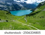 Hiking trail along the Oeschinensee Lake hike in Switzerland