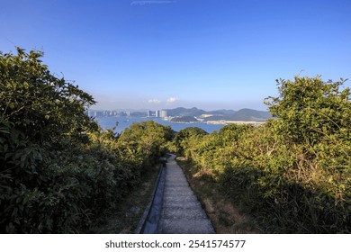 Hiking Trail with Panoramic View of Coastal City - Powered by Shutterstock