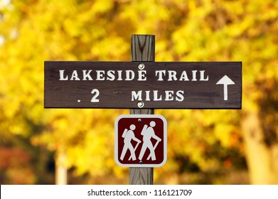 Hiking Trail Sign With Yellow Autumn Foliage