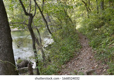 A Hiking Trail Winding Along The Banks Of A Spring-fed Stream In The Missouri Ozarks