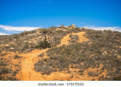 Hiking Trails in the San Diego Desert with Blue, Cloudy Sky and Distant Mountains - Spring Valley, California.
