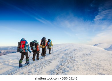 hiking in winter mountains. People traveling and sport concept