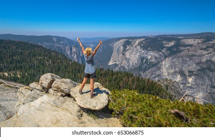 Hiking Woman Freedom In Yosemite National Park At Sentinel Dome Summit. Cheering Happy Hiker Enjoying View Of Popular El Capitan From Sentinel Dome. Summer Travel Holidays In California, United States