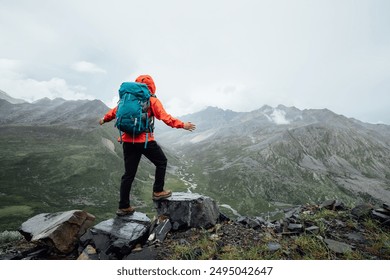 Hiking woman on high altitude mountain top - Powered by Shutterstock