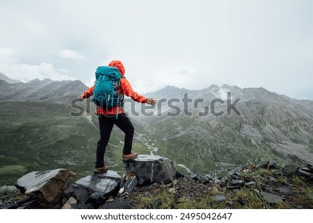 Image, Stock Photo Hiking in mountains. Mountain landscape. Scenic view of mountain peaks. Panoramic view. Natural scenery. Beautiful background