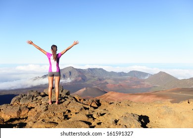 Hiking Woman On Top Happy And Celebrating Success. Female Hiker On Top Of The World Cheering In Winning Gesture Having Reached Summit Of Mountain, East Maui Volcano, Haleakala National Park Hawaii.