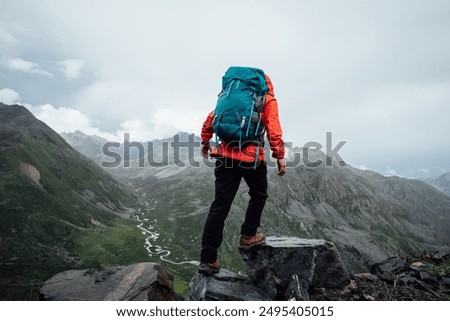 Hiking woman walking on high altitude mountain top
