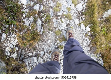 Hiking.Woman Legs With Hiking Boots On The Mountain Path , Top View