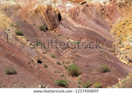 Hill of clay of different shades in the area called Martian landscape, Kyzyl-Chin valley, Chui steppe, Altai