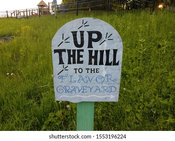 Up The Hill To The Flavor Graveyard Sign