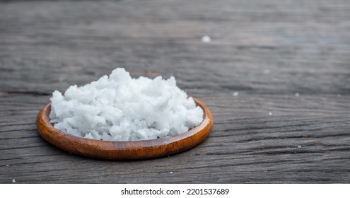 Hill Of Sea Salt In A Bowl On A Wooden Background