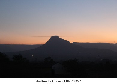 A hill side at sunset 