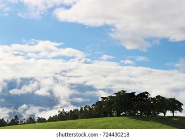 Hill With Trees On Top And Blue Sky With Clouds At Skogskyrkogården, Stockholm, Sweden