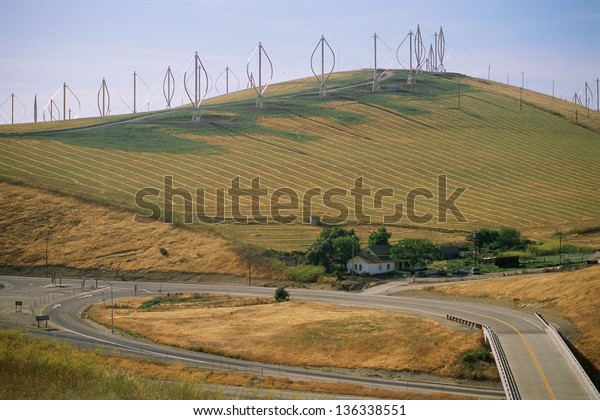 Hill with vertical-axis\
wind turbines