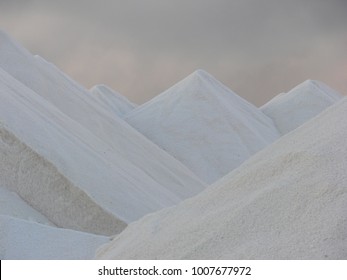 Hills Of Salt At A Desalination