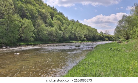 hills, water and forest landscape - Shutterstock ID 2186085373