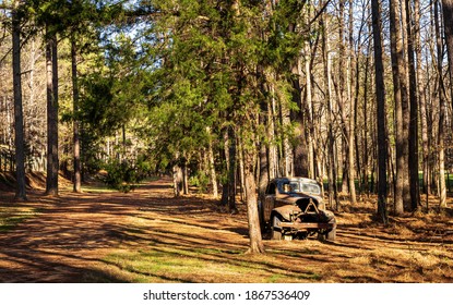 Hillsborough, North Carolina USA-12 03 2020: An Old Abandoned Race Car Parked On The Front Straightaway Of The Occoneechee Speedway. 