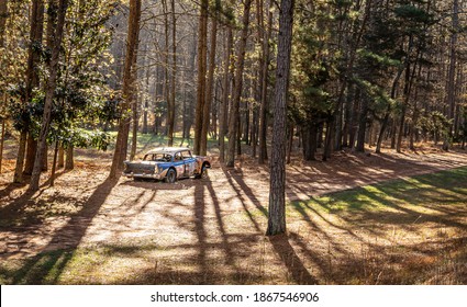 Hillsborough, North Carolina USA-12 03 2020: A Car Is Alone On The Abandoned Track At Occoneechee Speedway. View Is From The Grandstand.