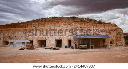 Hillside entrance to a dug out, an underground house in the opal mining town of Coober Pedy in the outback of South Australia