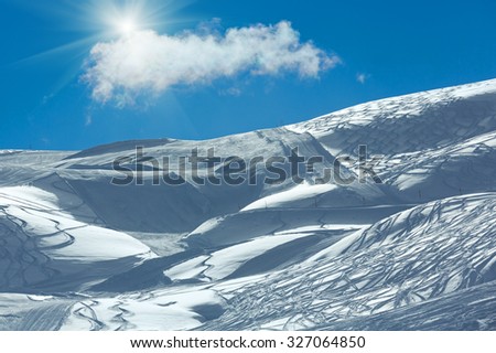 Similar – Foto Bild Wolken mit Sonnenstrahlen vor bergigen Vordergrund