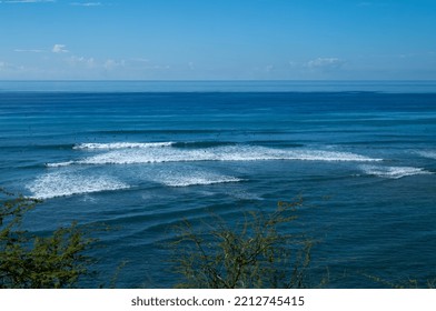 Hillside View Of Blue Sky And Ocean With Breaking Waves.