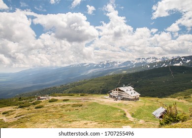 A Hilltop House On Its Own Amidst Snow Covered Peaks In Rila Mountain Ranges, Bulgaria