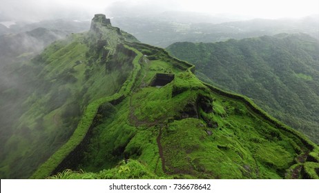 Hilltop stone bridge, ancient fort, green nature background aerial view of mountain landscape