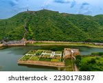 Hilltop view of the Mugal pattern gardens called Dil Aaram Bagh below the ancient Amer fort or Amber Fort in the city of Jaipur. Rajasthan, India.